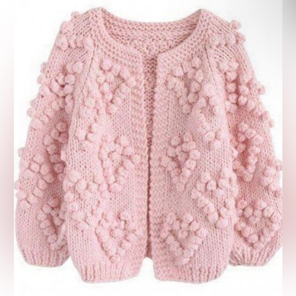 Chunky-knit baby pink cardigan sweater with heart detail